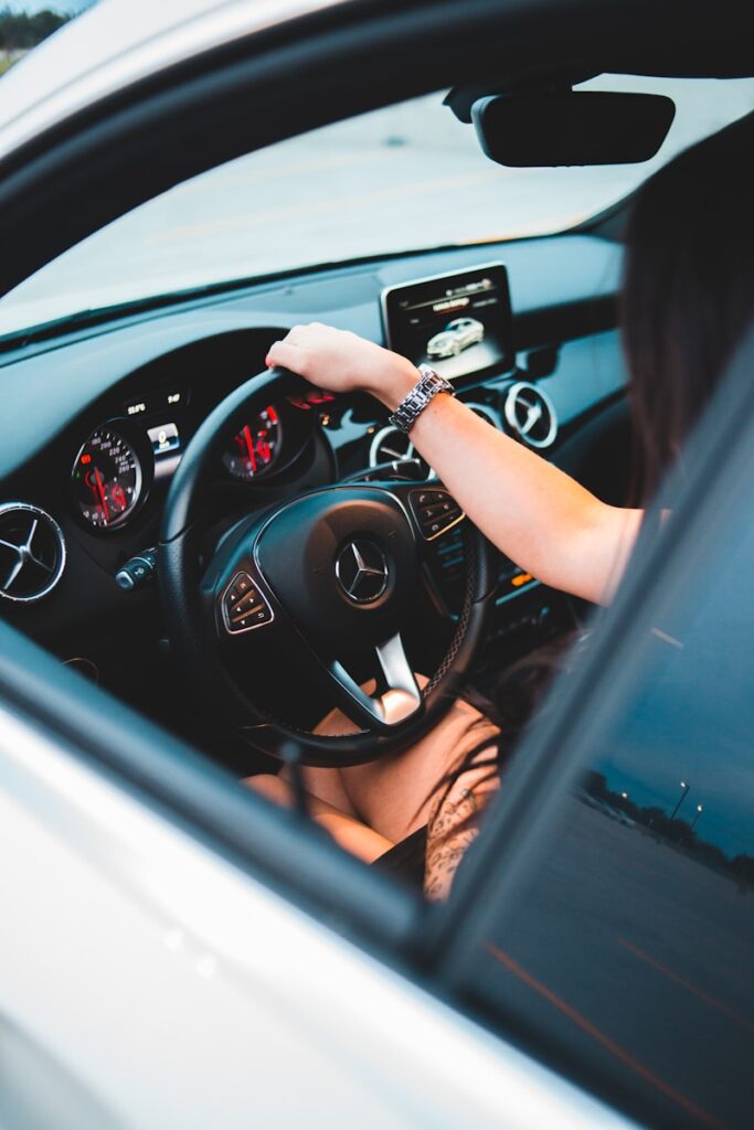 person driving car during daytime