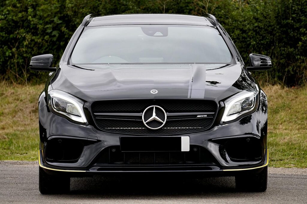 Luxurious black Mercedes-Benz AMG parked outdoors, showcasing elegance and style.