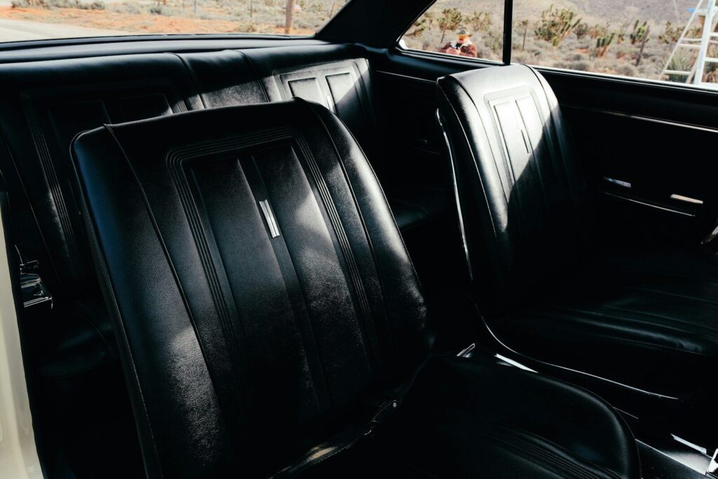 Black leather seats inside a vintage car