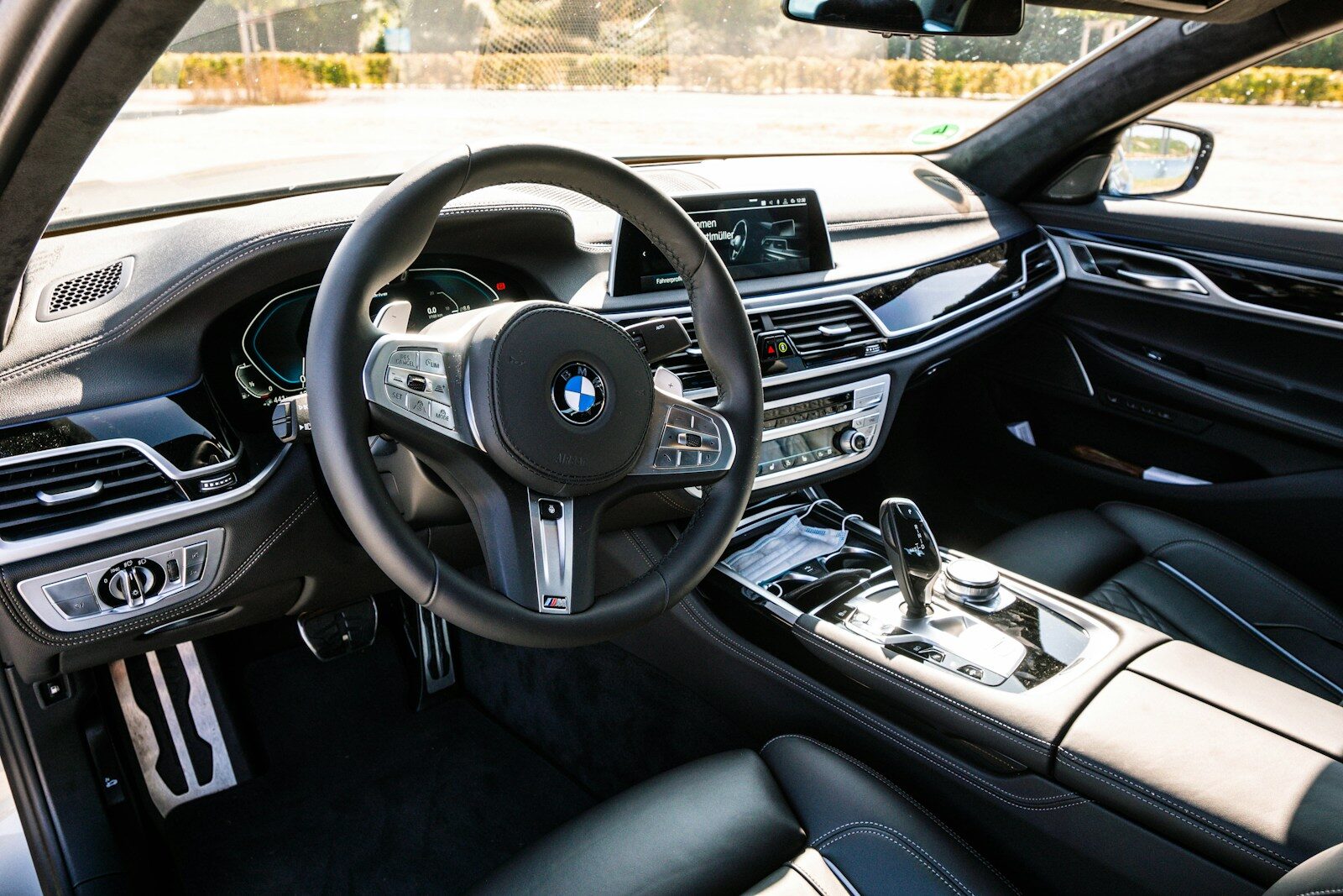 Photo by Philipp Katzenberger black bmw car steering wheel
