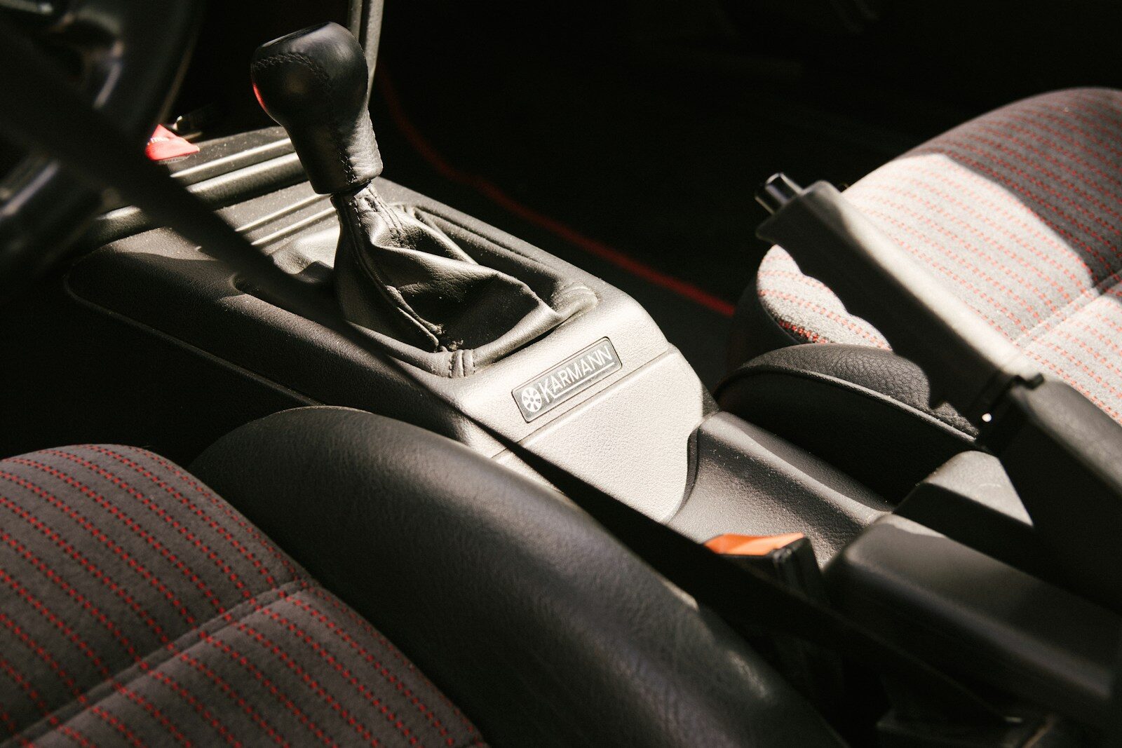 Close-up of a car's interior gear shift and handbrake