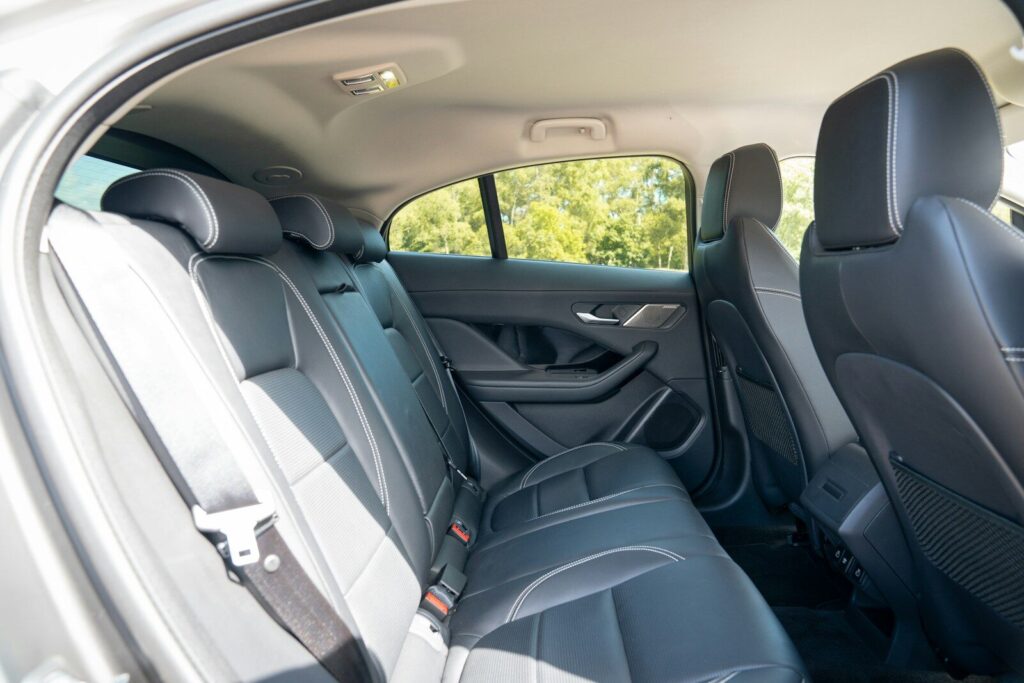 Black leather car seats in the back row.