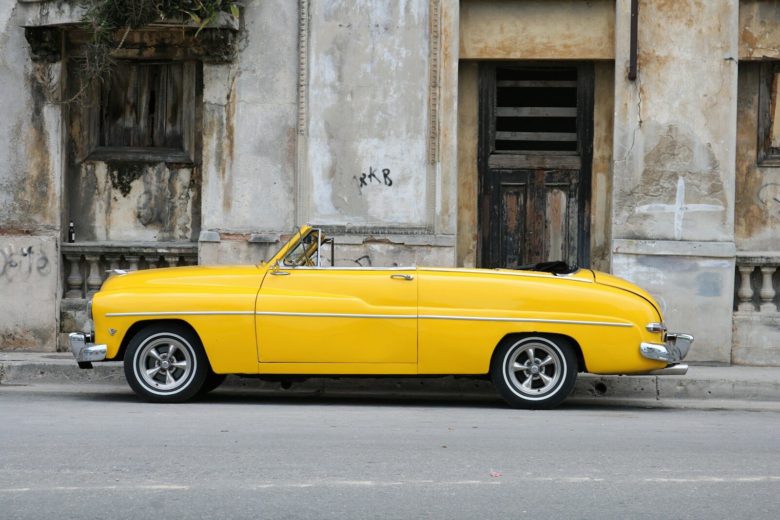 Photo by Joris Visser parked vintage classic car near concrete wall
