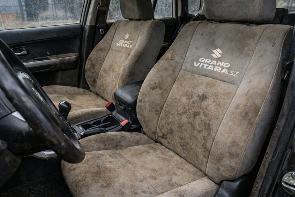 Dirty car seats with grand vitara logo