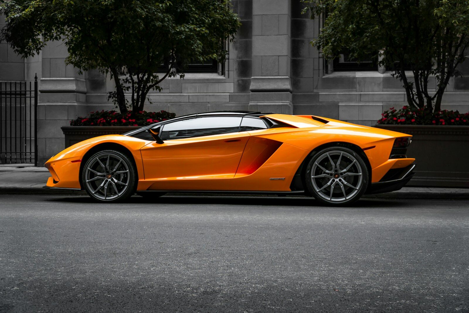 orange sports car on roadway Car Wrap Cost: What Drivers in Germantown Should Expect to Pay