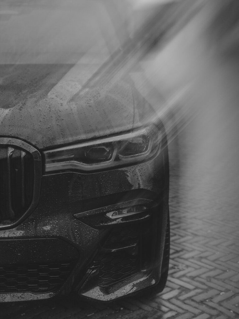 Black car with water droplets on it