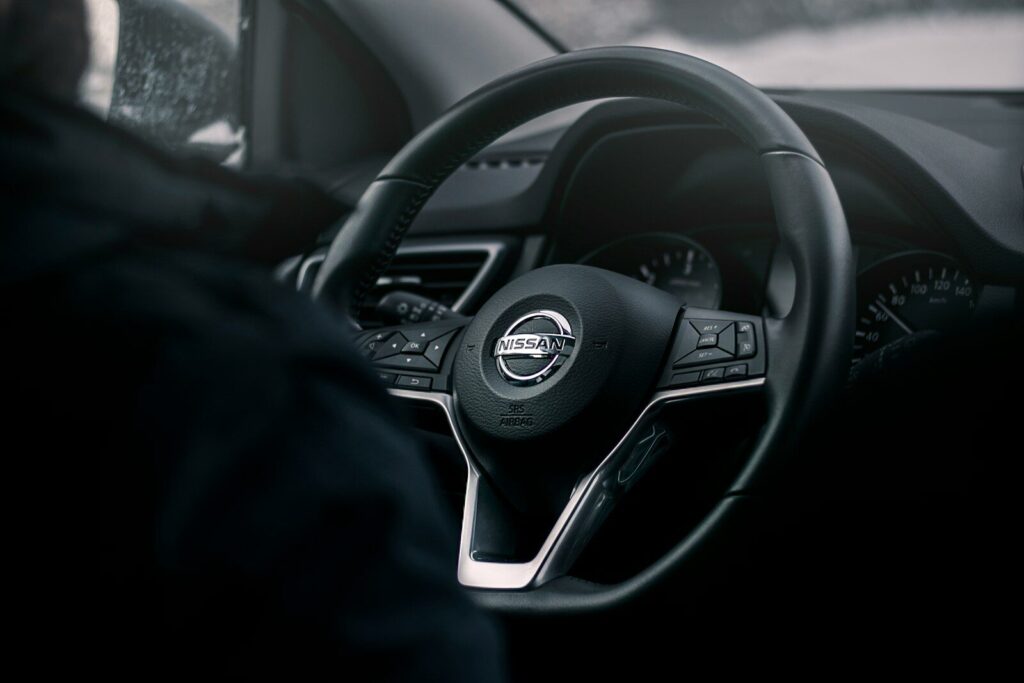 black Nissan steering wheel